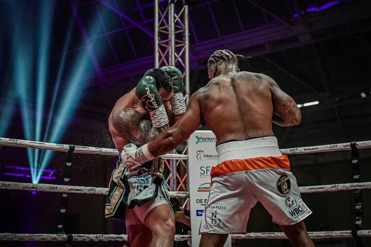 Ryad Merhy pressing an opponent onto the ropes